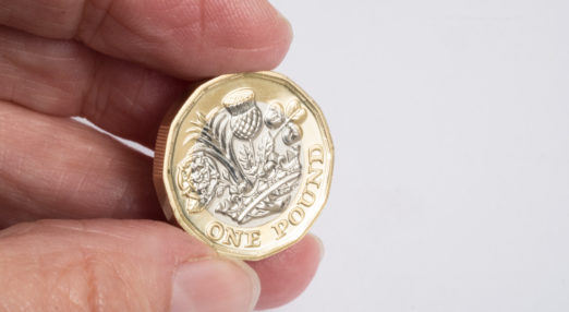 Close up image of a pound coin in a hand