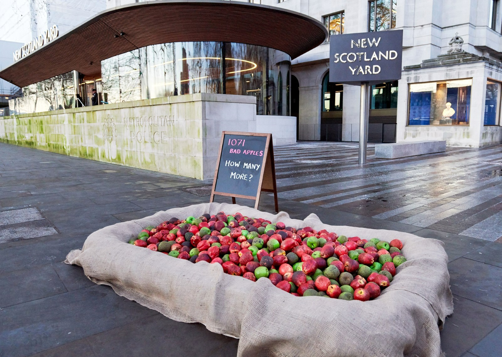 Collection of apples outside New Scotland Yard.