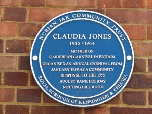 Photo of the Blue Plaque for Claudia Jones on a brick wall